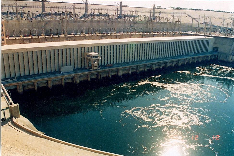 Aswan High Dam power station and spillway with churning Nile water below the turbines