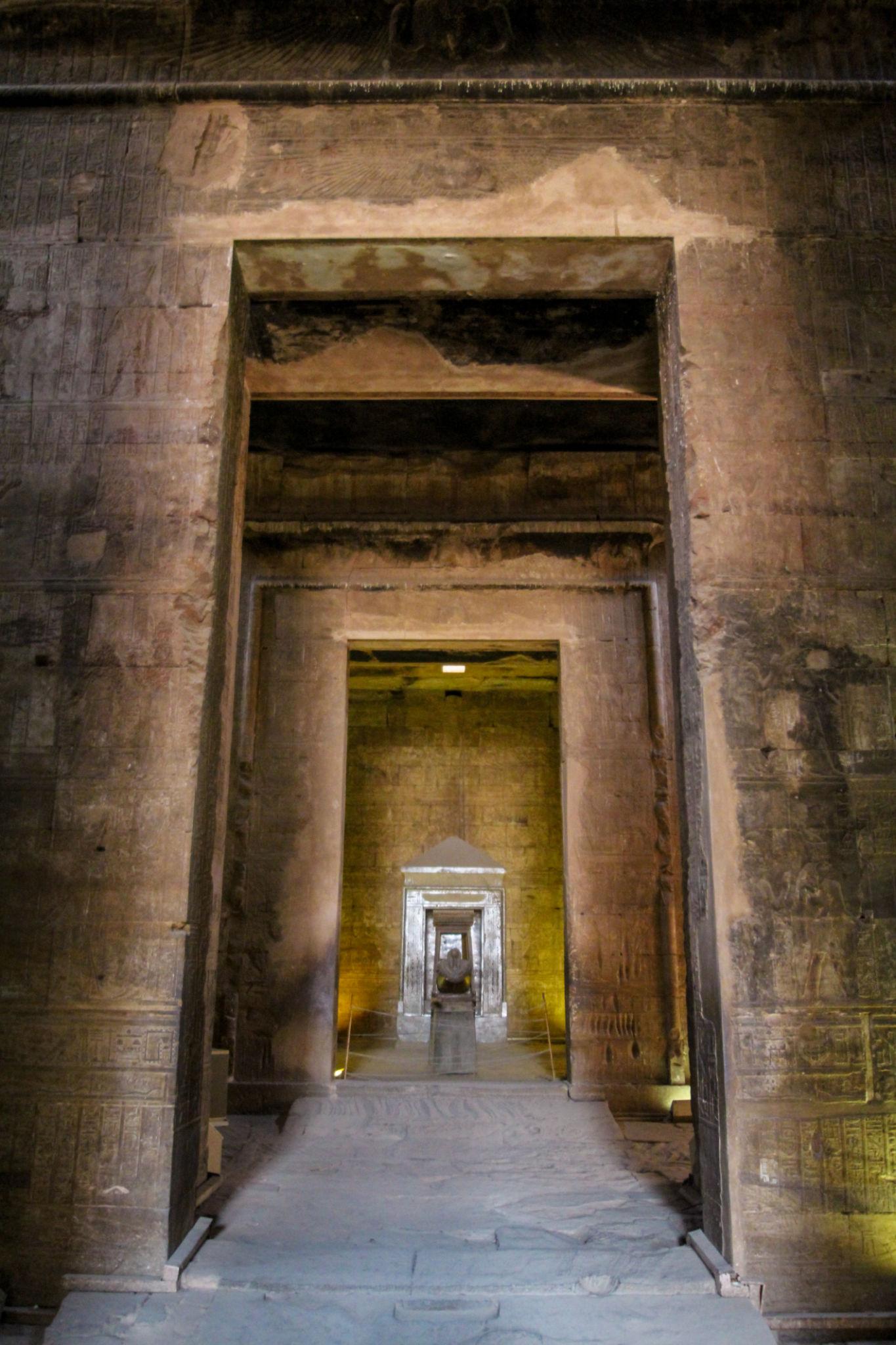 View through aligned doorways leading to the inner sanctuary of the Temple of Edfu.