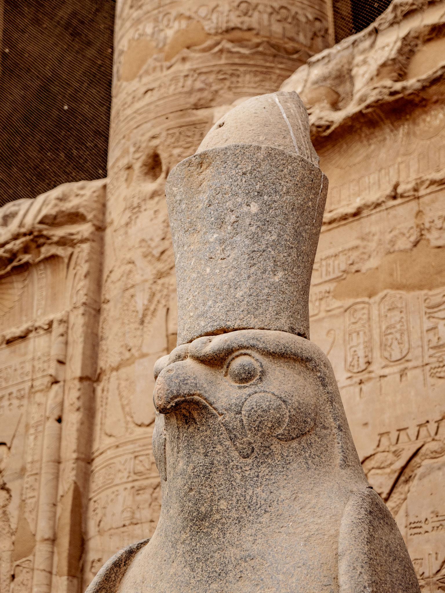 Closeup portrait of the Horus falcon statue wearing the double crown at Edfu.