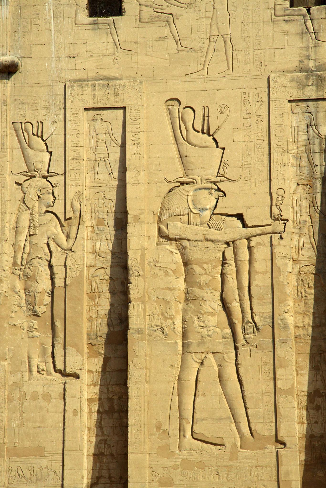 Large relief of the falcon-headed god Horus on the pylon of the Temple of Edfu.