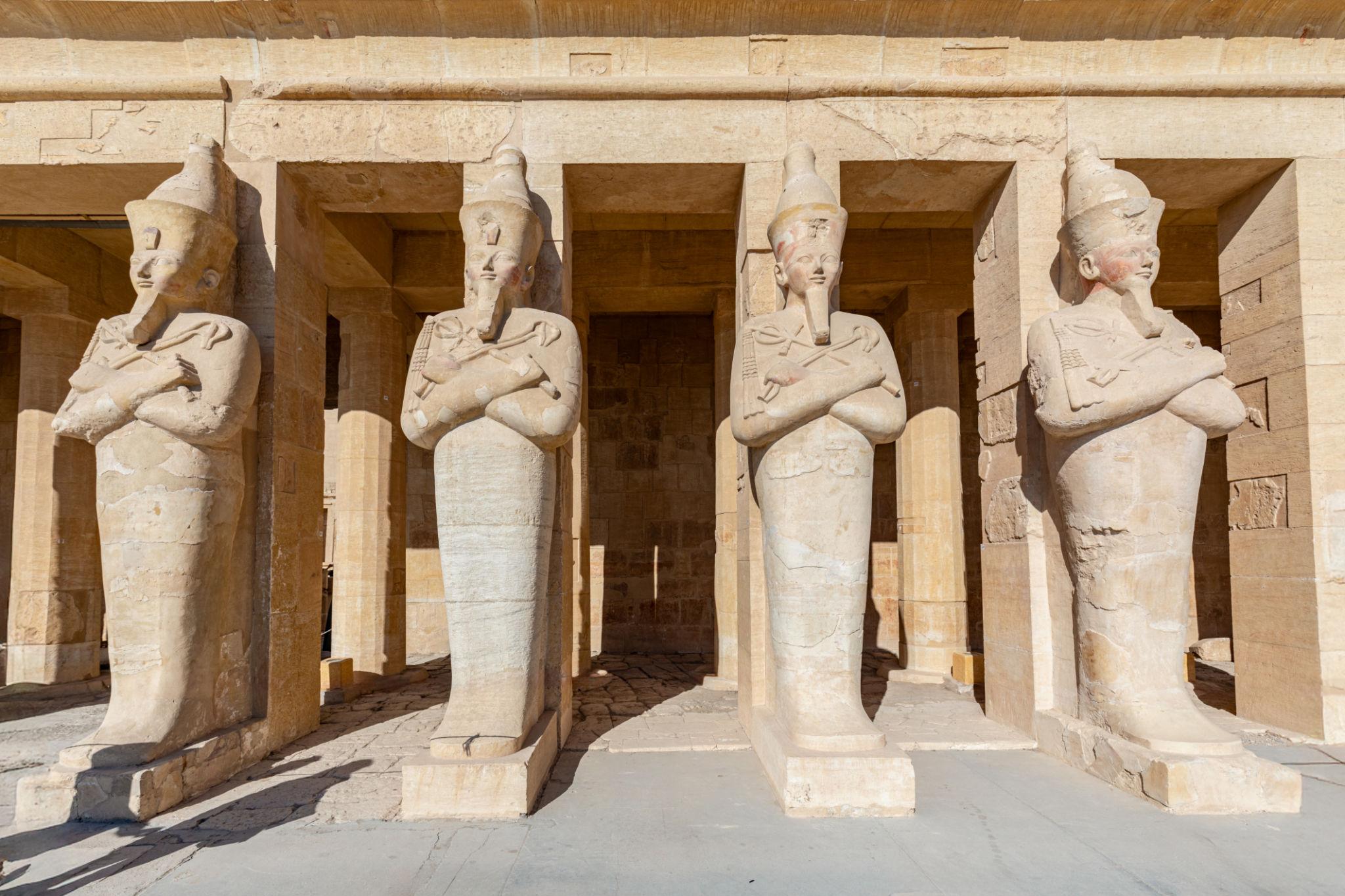 Row of Osirid statues of Hatshepsut along the upper terrace portico