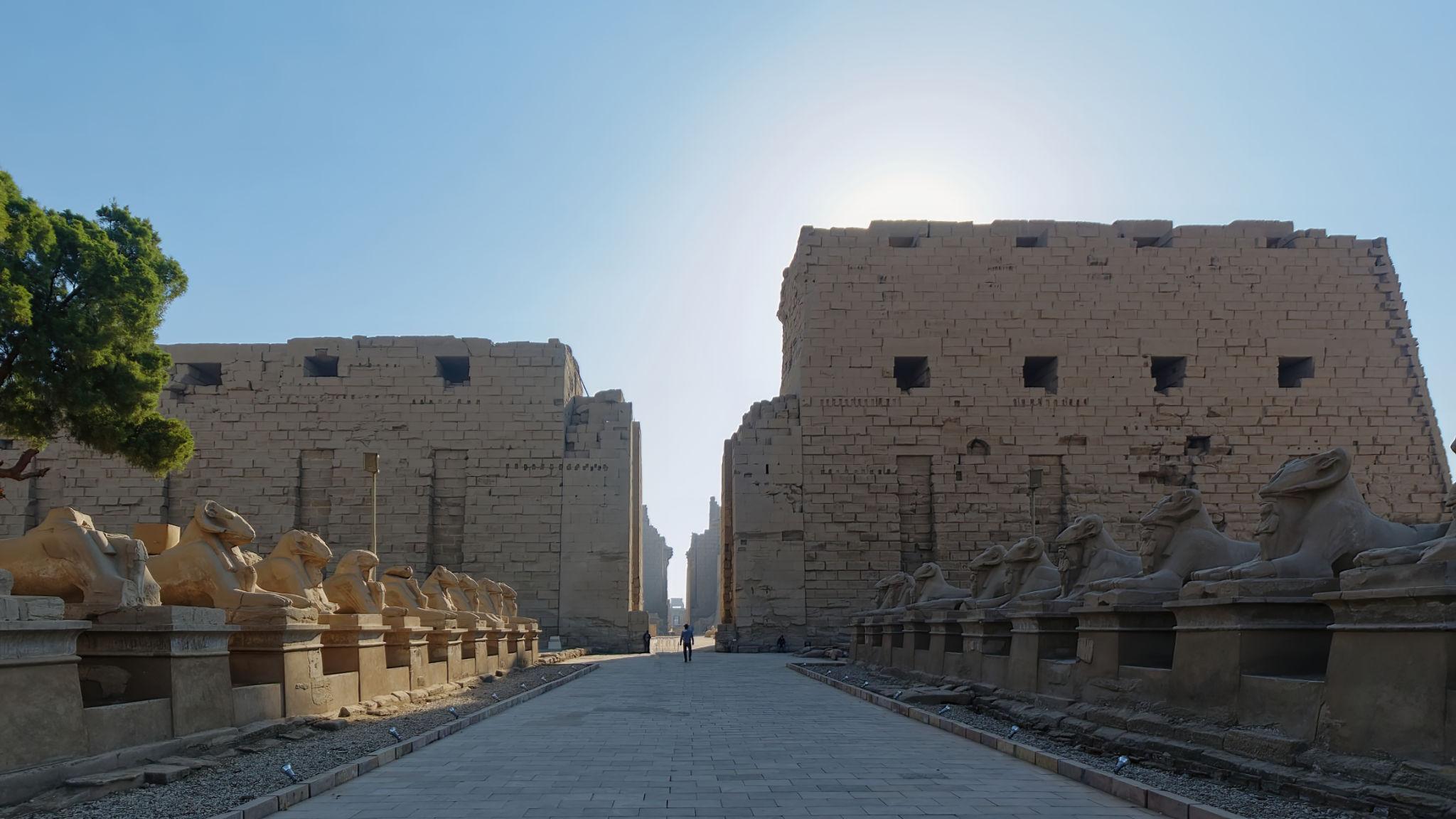 First pylon entrance flanked by ram-headed sphinxes at Karnak Temple