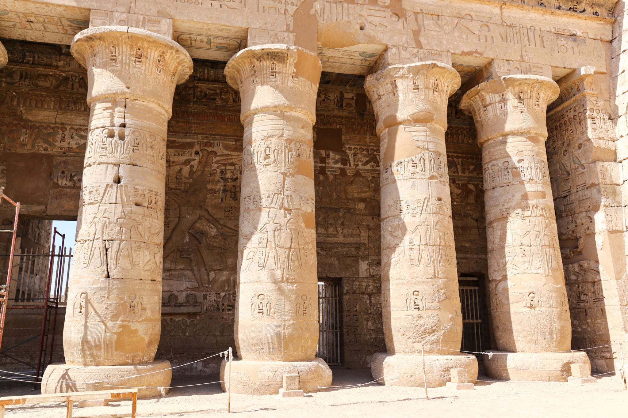 Row of carved papyrus columns lining the second court at Medinet Habu.