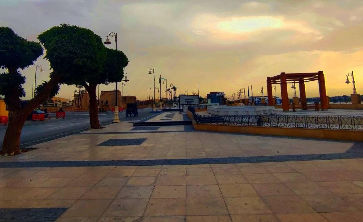 Empty Luxor corniche plaza at golden sunset near the Nile