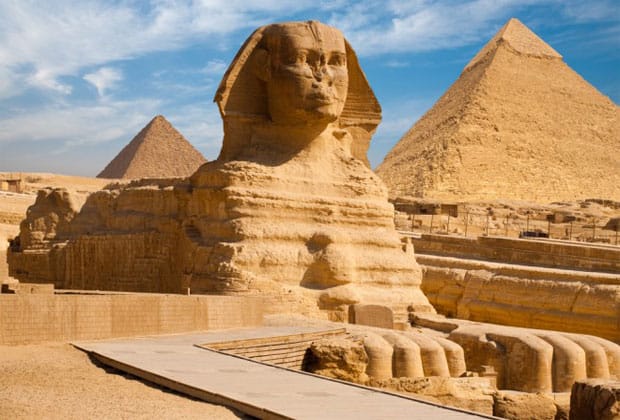 Great Sphinx of Giza in profile with the Pyramid of Khafre towering behind