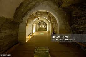 Vaulted underground gallery of the Serapeum of Saqqara with arched stone corridors