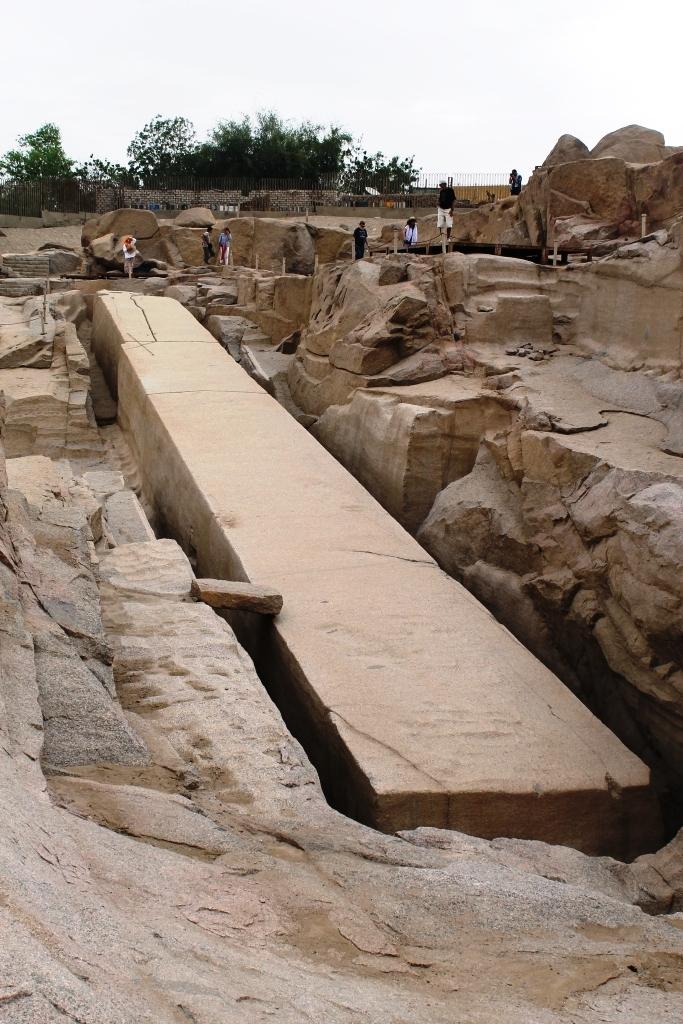 The massive Unfinished Obelisk still attached to bedrock in an ancient granite quarry in Aswan.