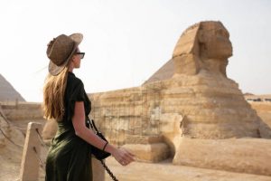 A trip to remember. A young woman in front of the Sphynx.