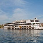 Large luxury traditional Egyptian river cruise boat sailing on the Nile