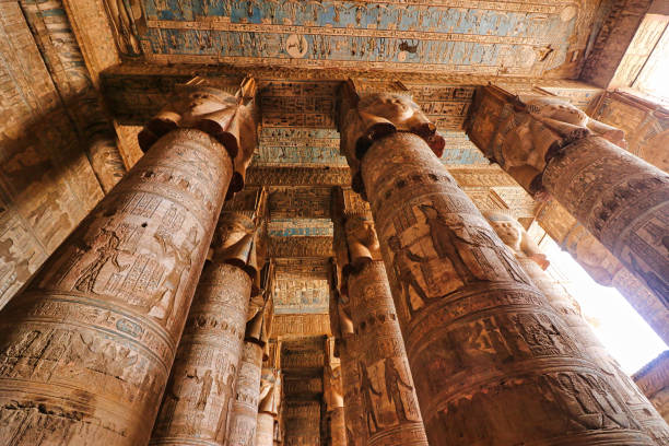 Intricate ceiling art with four-faced Hathor Head pillars in the hypostyle hall in the Temple of Hathor at Dendera completed in the Ptolemaic era around 50 BC between Luxor and Abydos towns,Egypt